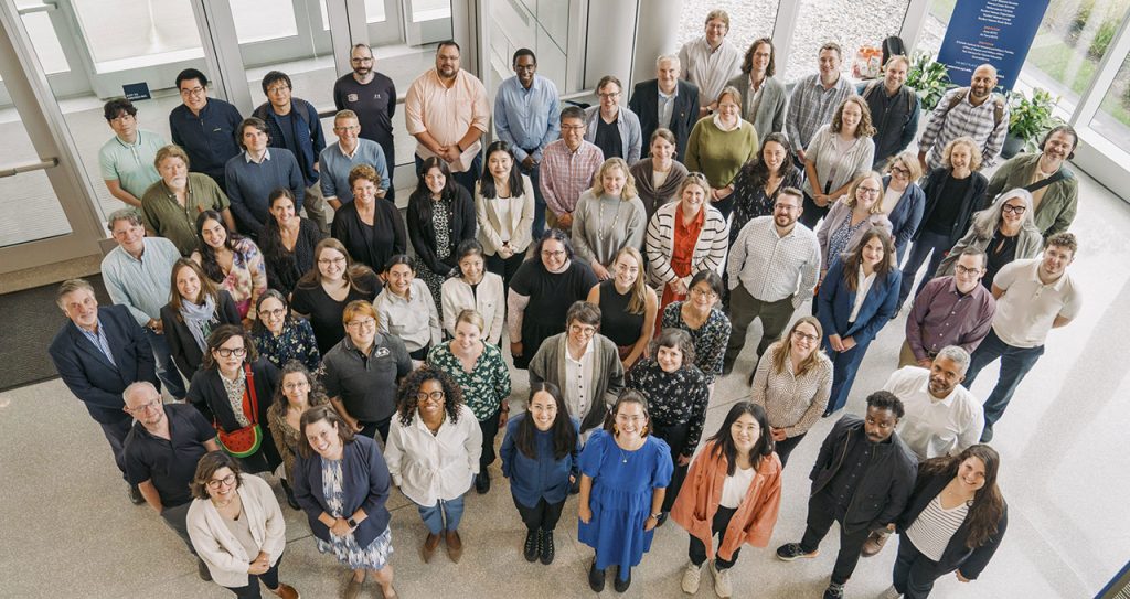 new faculty members posing in a group photo